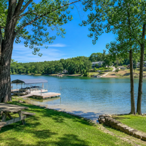Discover an enticing Arkansas Residential Lot  & Walk to the Lake Thunderbird -A residential lot nestled near the serene shores of Lake Omaha, perfectly primed for constructing your dream home or placing a charming mobile home. Cherokee Village- Utilities at the property and road frontage: APN: 335-18623-000