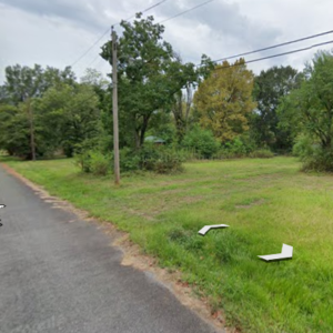 Residential Lot with mobile home on it in Ouachita County offers power, water and sewer in a relaxed South Arkansas lifestyle with a mix of small-town communities, wooded scenery, river access, and lower-density living. APN: 939-00029-000R