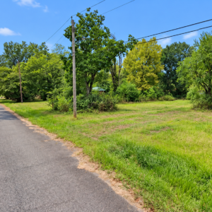 Residential Lot with mobile home on it in Ouachita County offers power, water and sewer in a relaxed South Arkansas lifestyle with a mix of small-town communities, wooded scenery, river access, and lower-density living. APN: 939-00029-000R