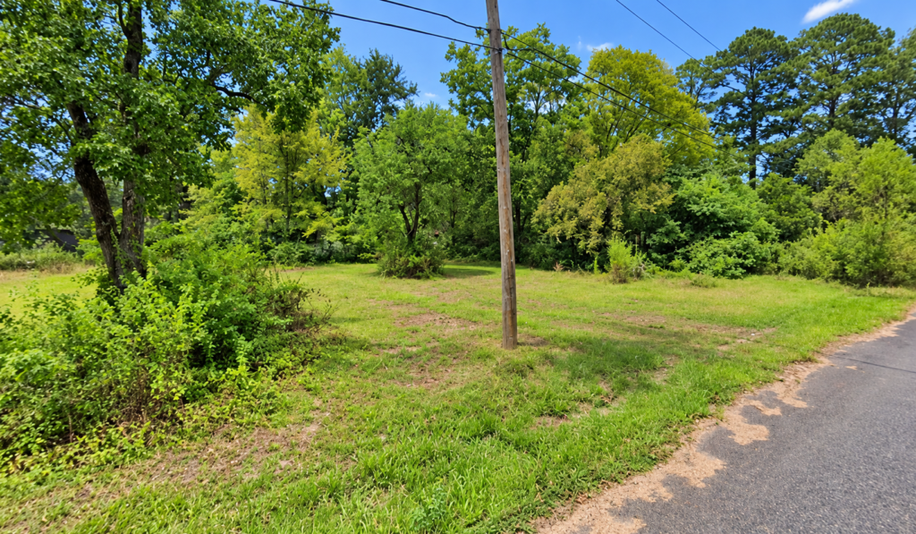 Residential Lot with mobile home on it in Ouachita County offers power, water and sewer in a relaxed South Arkansas lifestyle with a mix of small-town communities, wooded scenery, river access, and lower-density living. APN: 939-00029-000R