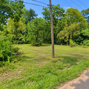 Residential Lot with mobile home on it in Ouachita County offers power, water and sewer in a relaxed South Arkansas lifestyle with a mix of small-town communities, wooded scenery, river access, and lower-density living. APN: 939-00029-000R