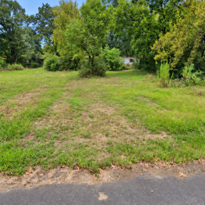 Residential Lot with mobile home on it in Ouachita County offers power, water and sewer in a relaxed South Arkansas lifestyle with a mix of small-town communities, wooded scenery, river access, and lower-density living. APN: 939-00029-000R